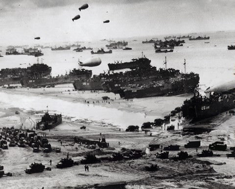 Fleets of US transport and landing craft disgorge reinforcements and supplies for the US troops Sale